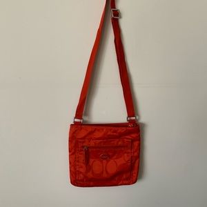 Coach orange/reddish crossbody handbag